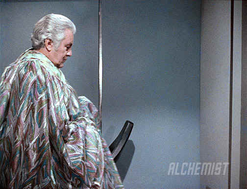 This is an image of Melvin Belli getting into position in front of the children. This bit was cut out, and then the shimmering effect put in its place so that it would appear that he shimmered in.